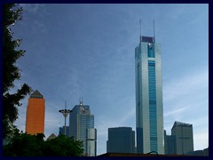 Skyline of the Tianhe district's West part, that is bordering Zhujiang New Town (ZNT) to the North. Before ZNT was built  in the 2010s, most skyscrapers were situated in this area. CITIC Plaza, the blue skyscraper to the right, was then, in 1996, the tallest building in Asia and the tallest in Guangzhou until 2010. The golden glass building to the left is Metro Plaza (48 floors), also built in 1996.